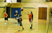 Mike throws the ball up court.